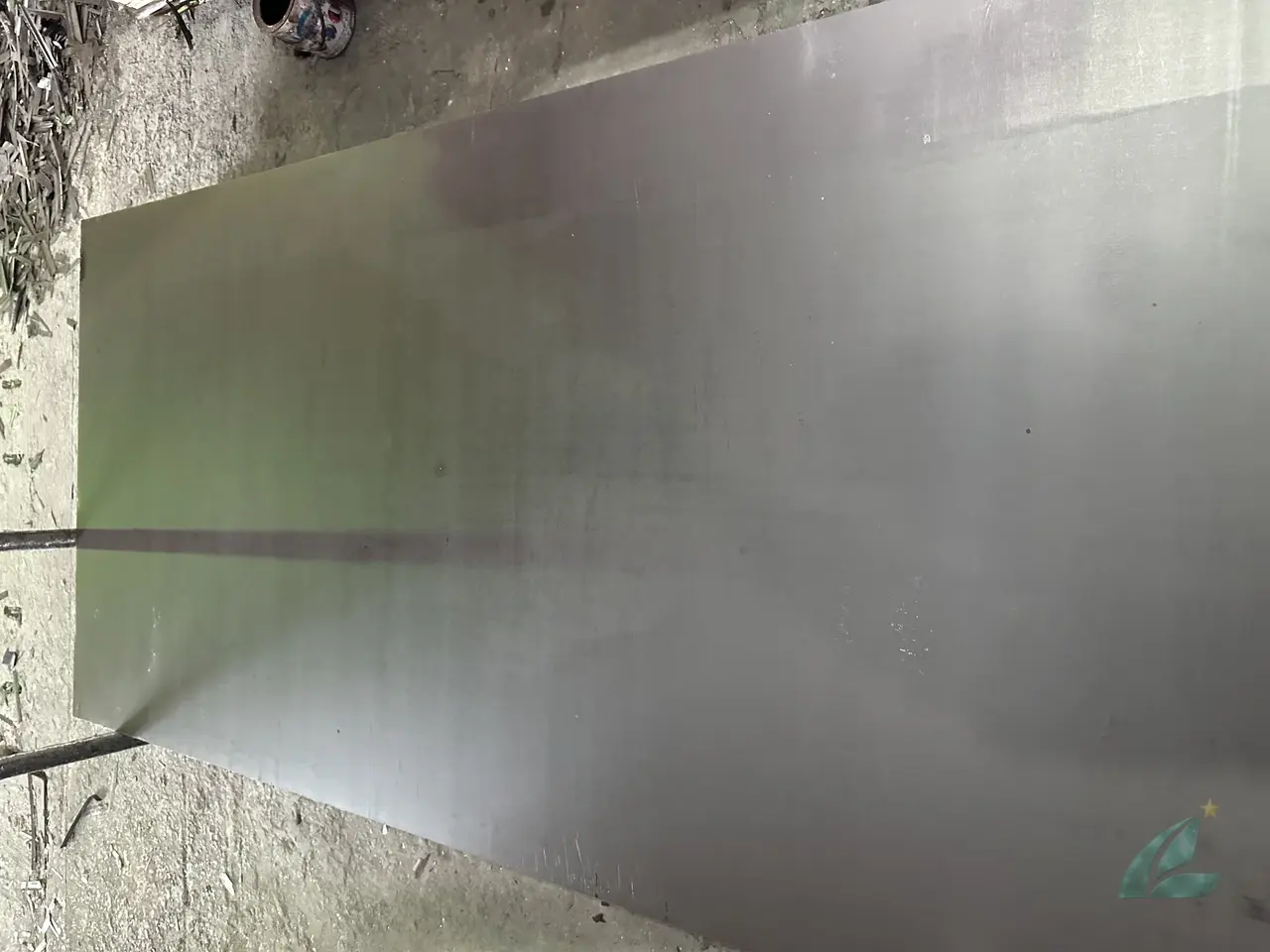 Film faced plywood edge sealing detail showing painted edges to prevent moisture ingress during concrete formwork cycling at Mika Plywood Vietnam